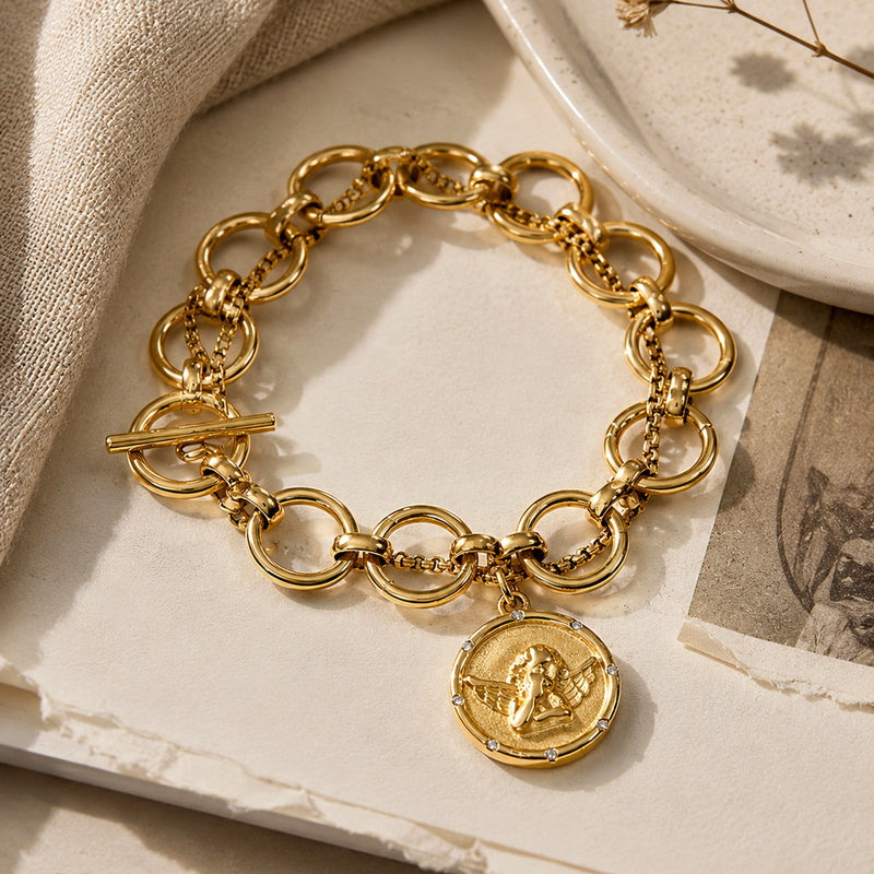 Close view of Onni Coin Charm Bracelet with coin pendant detail