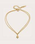 Aster Shore Pendant Anklet on a soft warm grey background