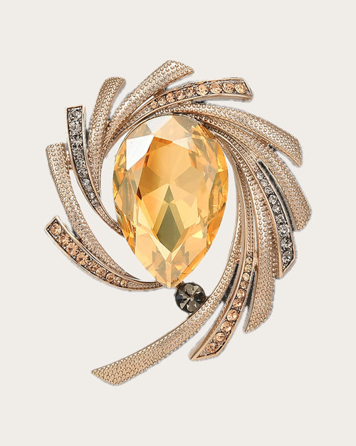 Astra Orbit Crystal Brooch on a soft warm grey background