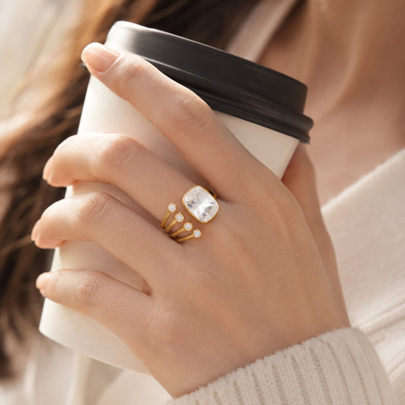 Gold adjustable crystal ring worn on hand