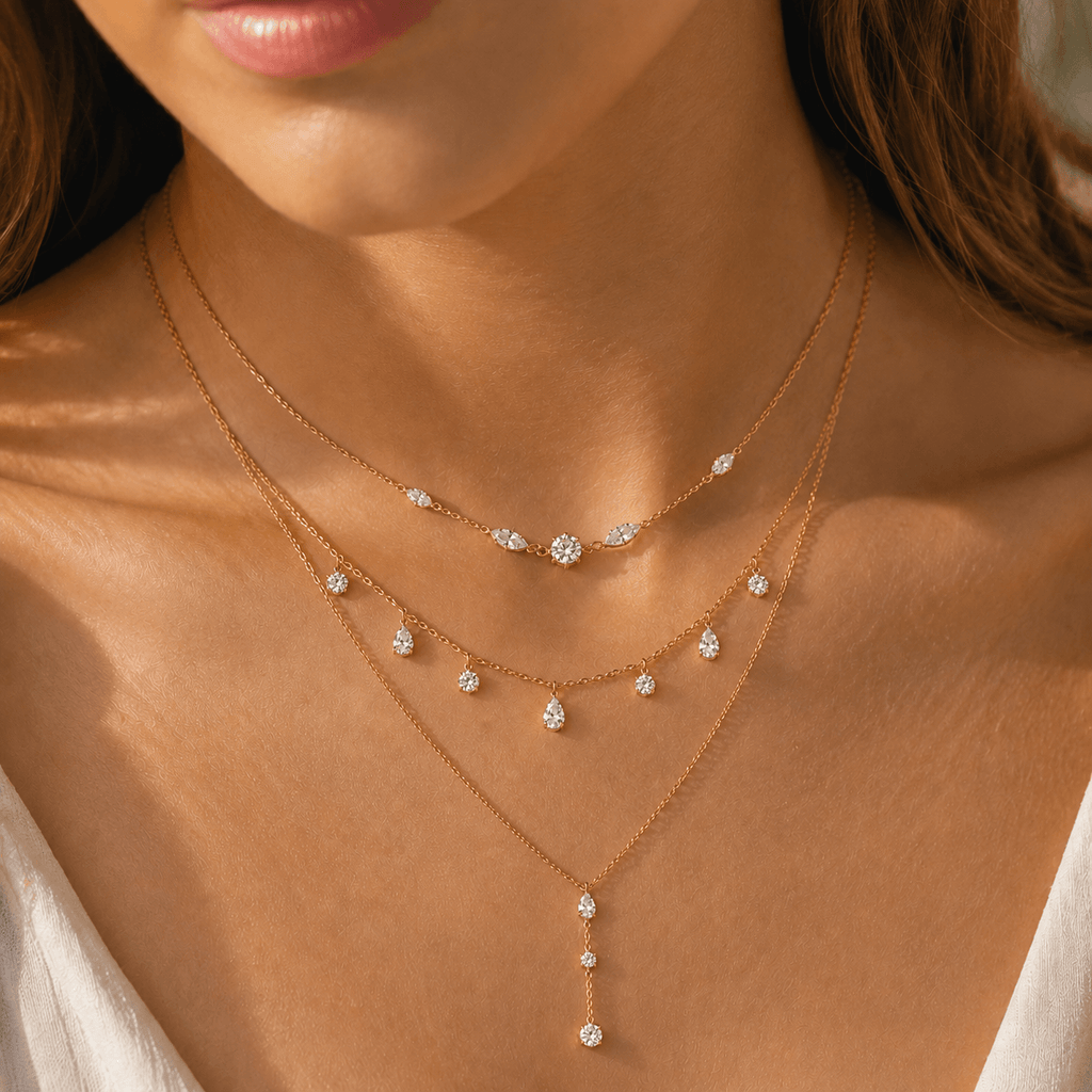 Aurelia Light layered gold crystal necklace worn with a champagne satin neckline