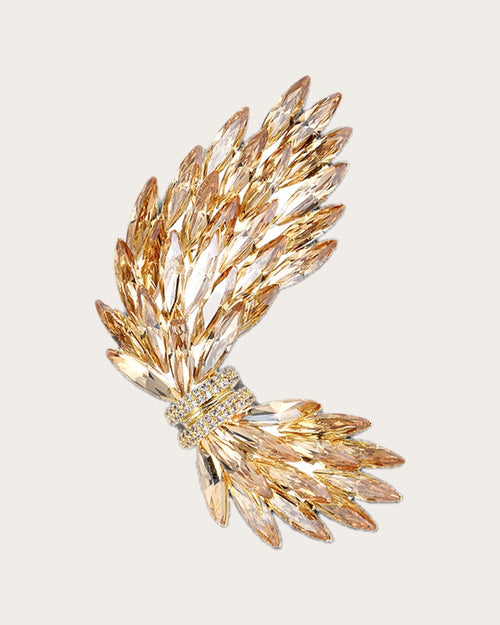 Aurelia Wing Crystal Brooch on a soft warm grey background
