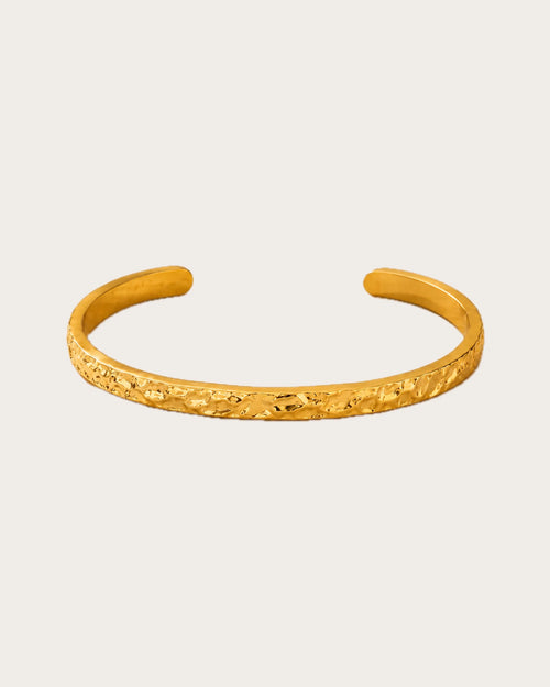 Auren Ridge Cuff Bracelet on a soft warm grey background