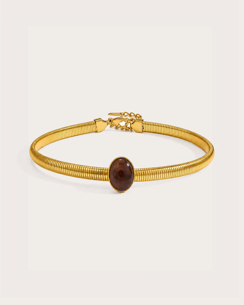 Cira Amber Collar Necklace on a soft warm grey background