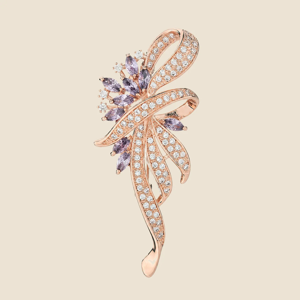 Elowen Crystal Spray Brooch in rose gold and lavender on an exact #EDE3D4 background