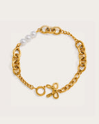 Helmi Pearl Heart Bracelet on a soft warm grey background