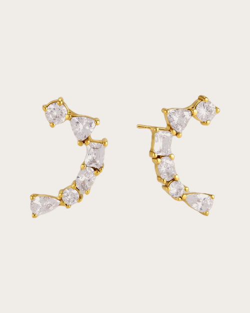 Ilo Smile Pavé Stud Earrings on a soft warm grey background