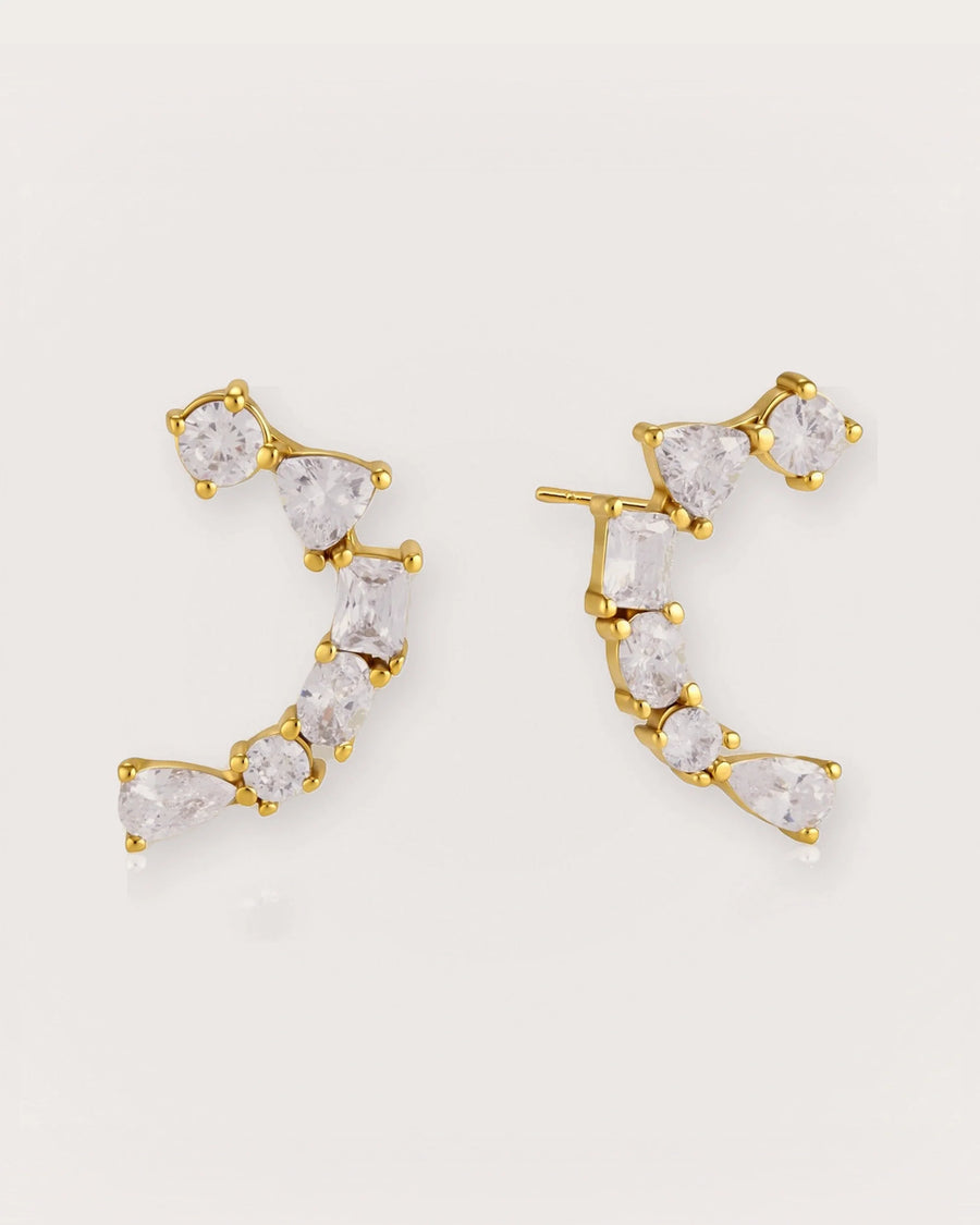 Ilo Smile Pavé Stud Earrings on a soft warm grey background