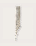 Kajo Crystal Cascade Brooch on a soft warm grey background