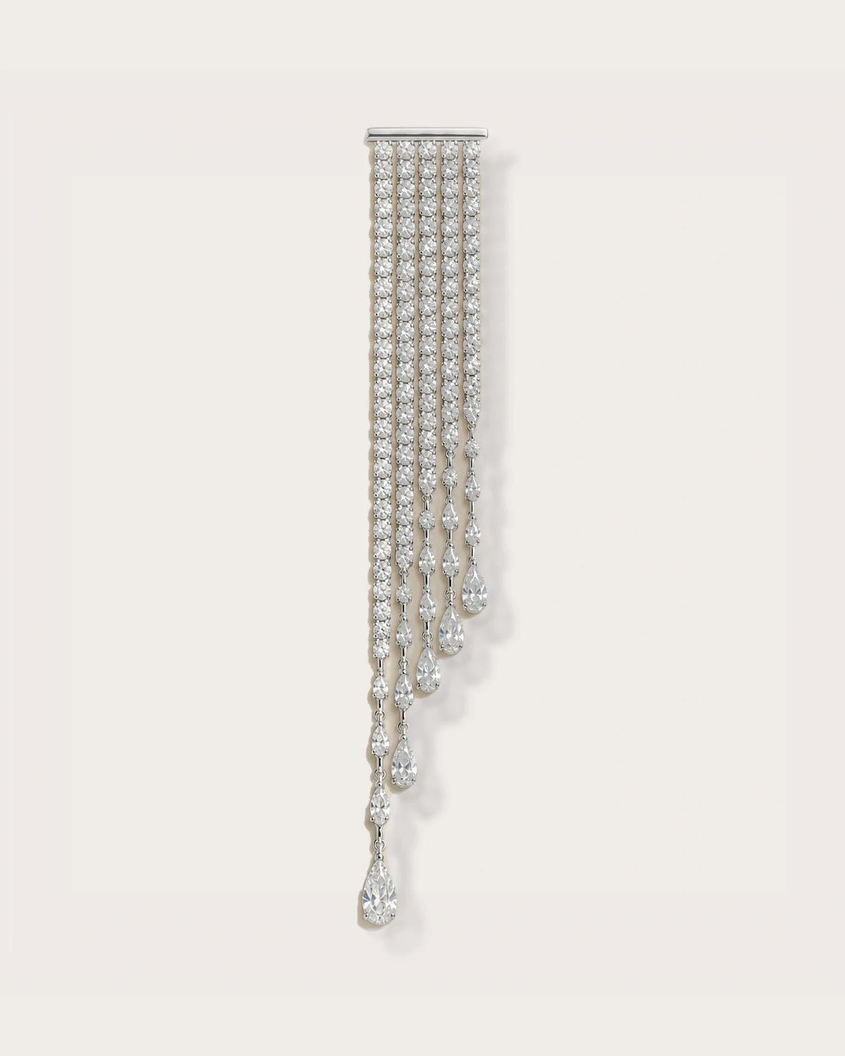 Kajo Crystal Cascade Brooch on a soft warm grey background
