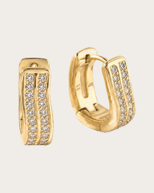 Kide Double-Row Crystal Huggie Earrings on a soft warm grey background