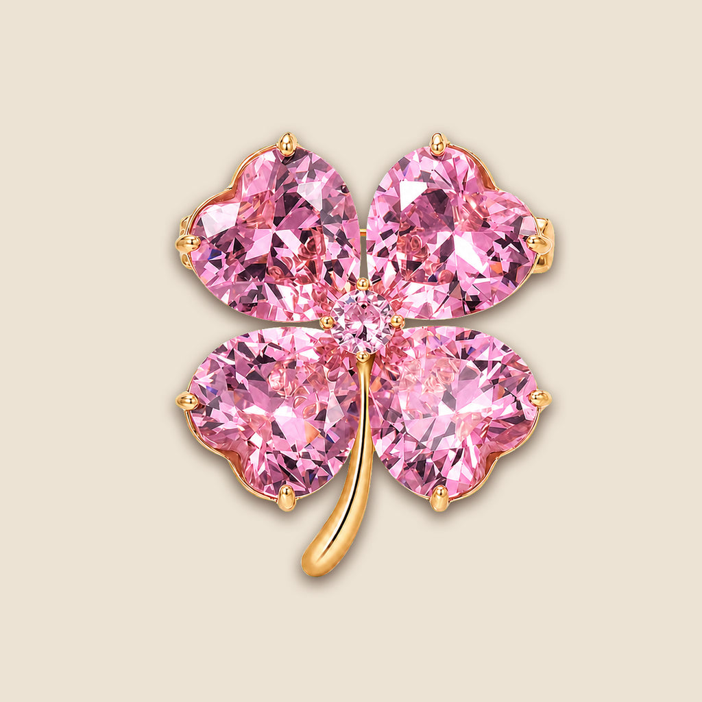 Lykke Pink Clover Brooch with four heart-shaped pink stones on a warm beige background