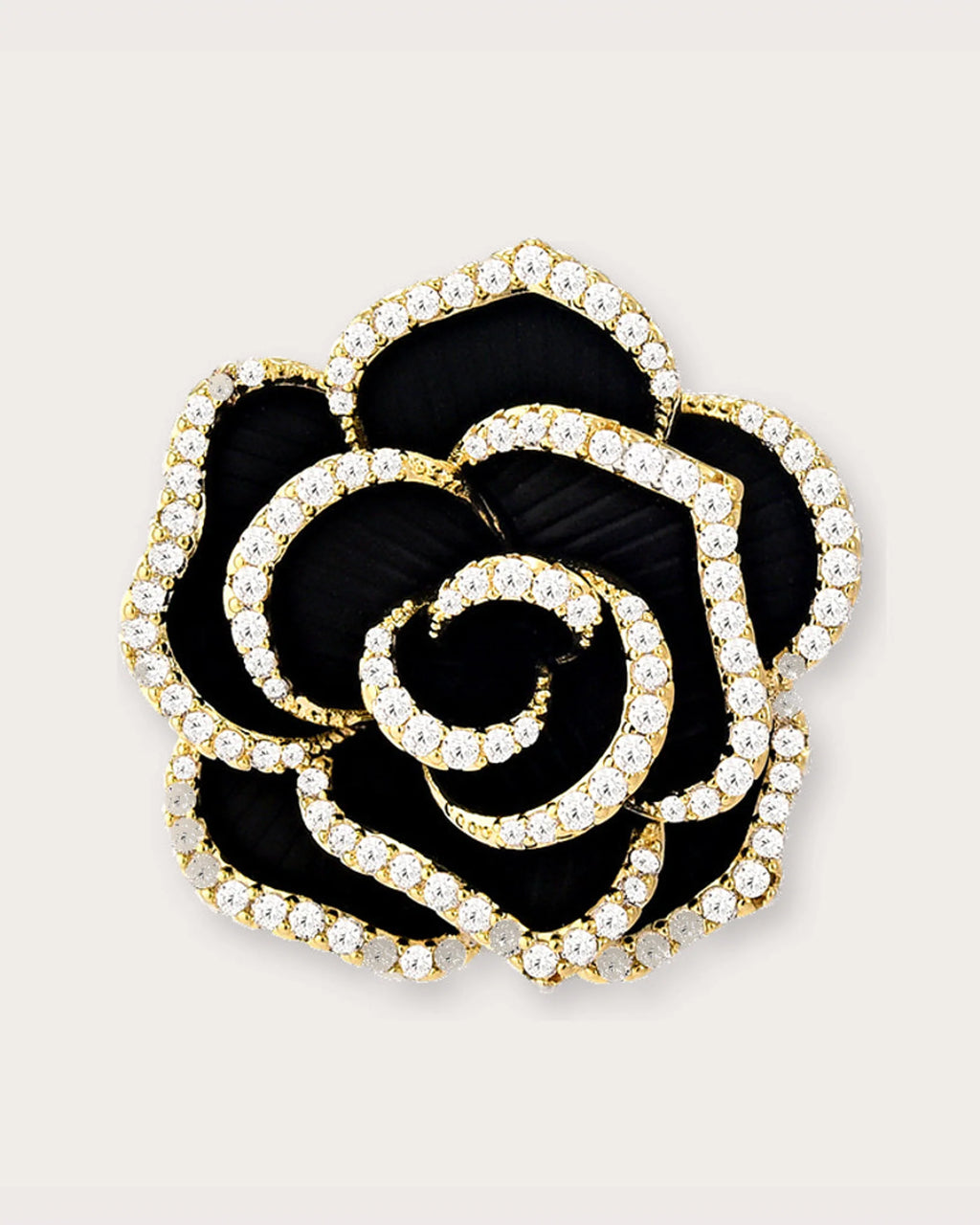 Noir Camellia Brooch on a soft warm grey background