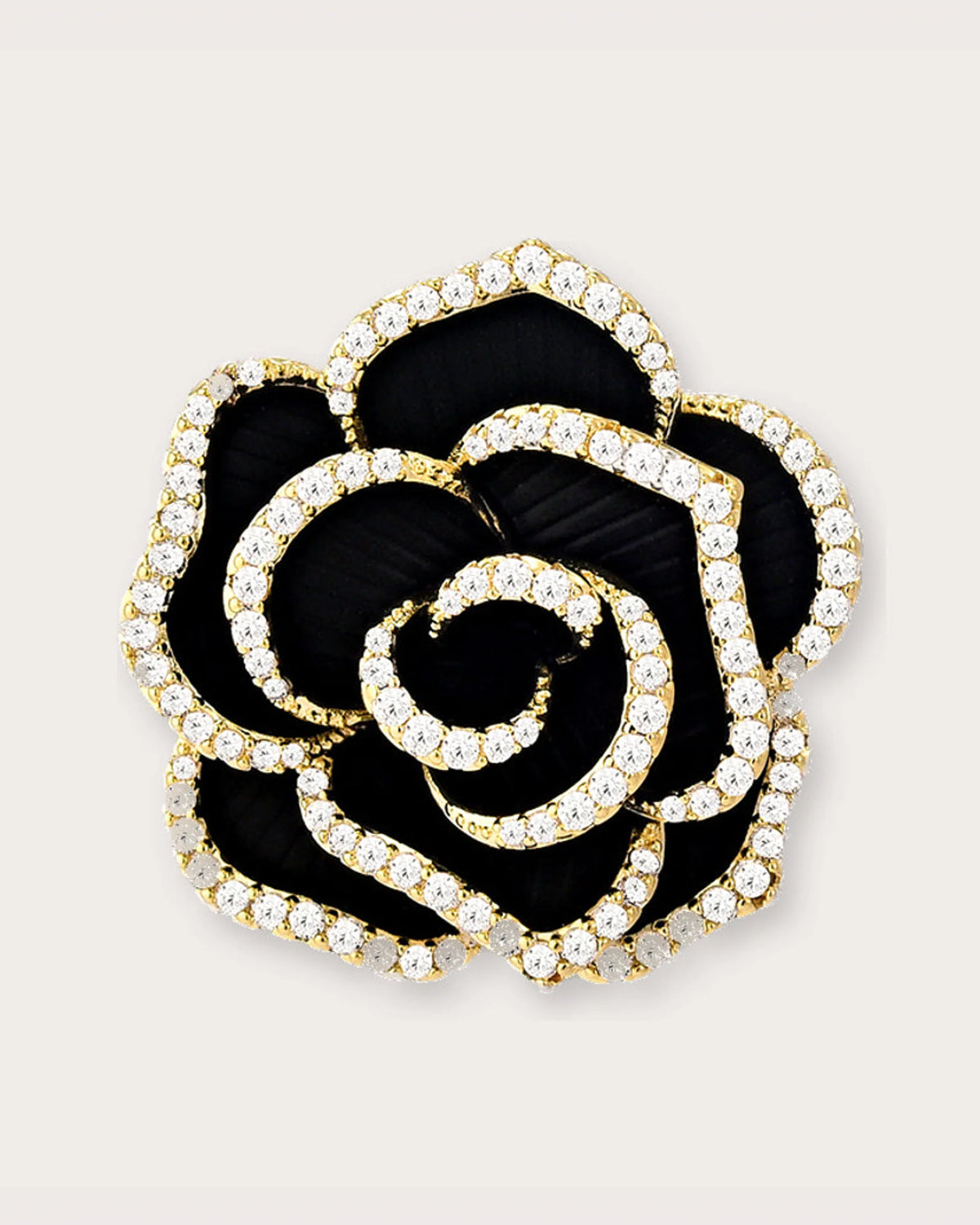 Noir Camellia Brooch on a soft warm grey background