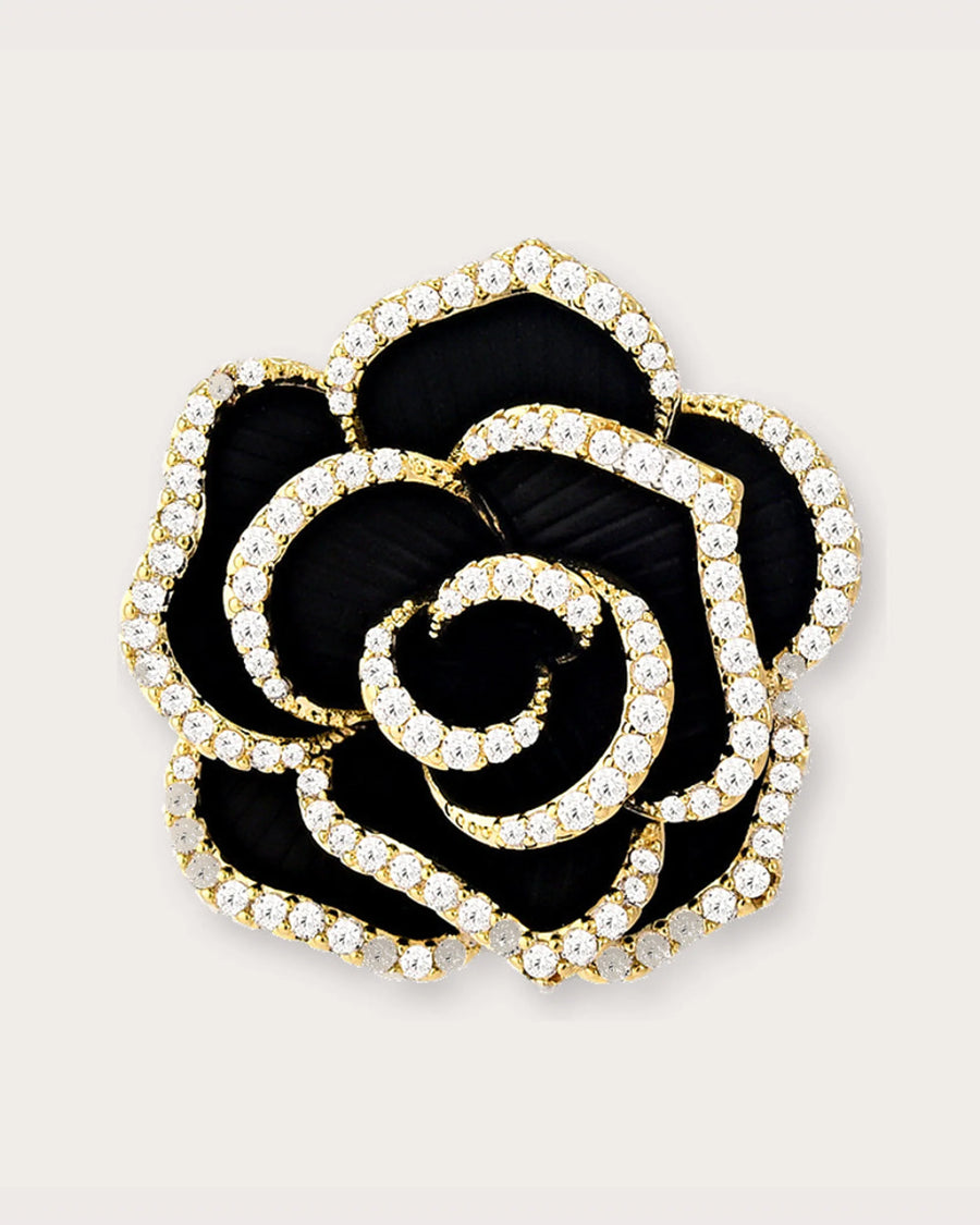 Noir Camellia Brooch on a soft warm grey background