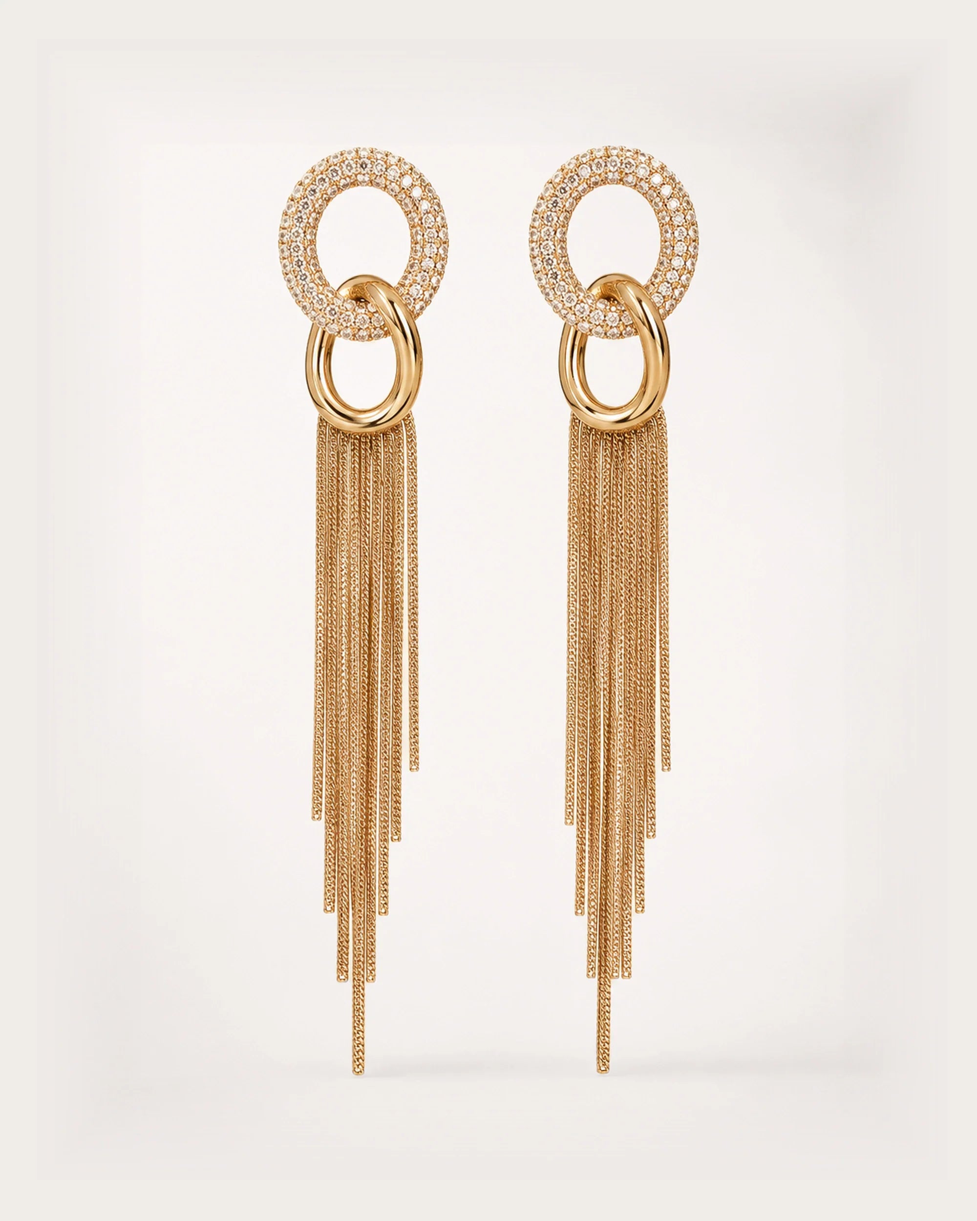 Hohto Pavé Tassel Earrings on a soft warm grey background