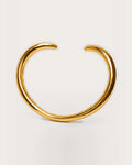 Aalto Gold Heart Cuff Bracelet on a soft warm grey background