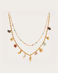 Ranta Charm Necklace on a soft warm grey background