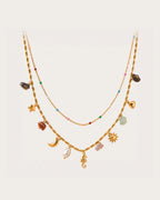 Ranta Charm Necklace on a soft warm grey background