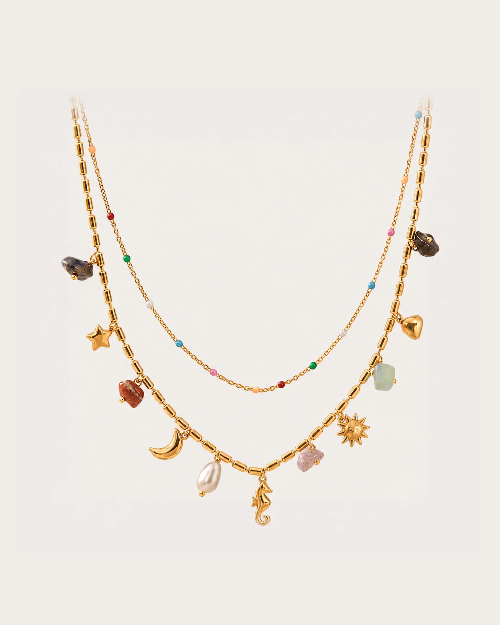 Ranta Charm Necklace on a soft warm grey background