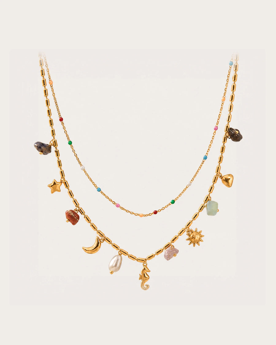 Ranta Charm Necklace on a soft warm grey background