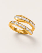 Serra Crystal Coil Ring on a soft warm grey background