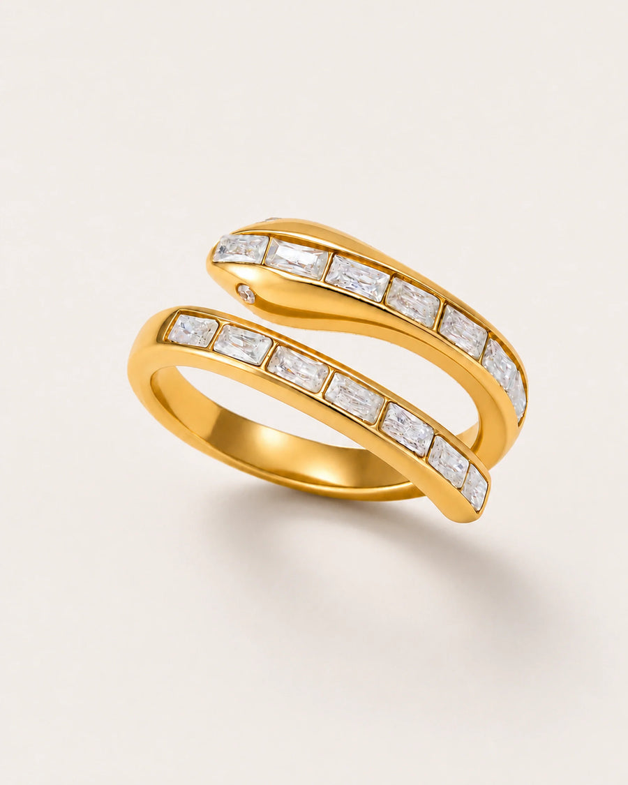 Serra Crystal Coil Ring on a soft warm grey background
