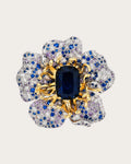 Sini Midnight Bloom Brooch on a soft warm grey background