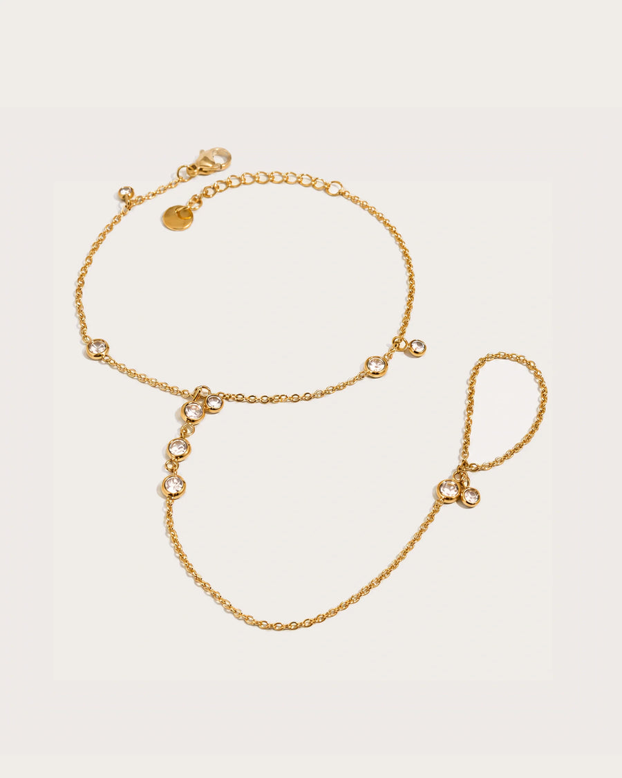 Siro Crystal Hand Chain on a soft warm grey background