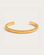 Solvi Bead Cuff Bracelet on a soft warm grey background