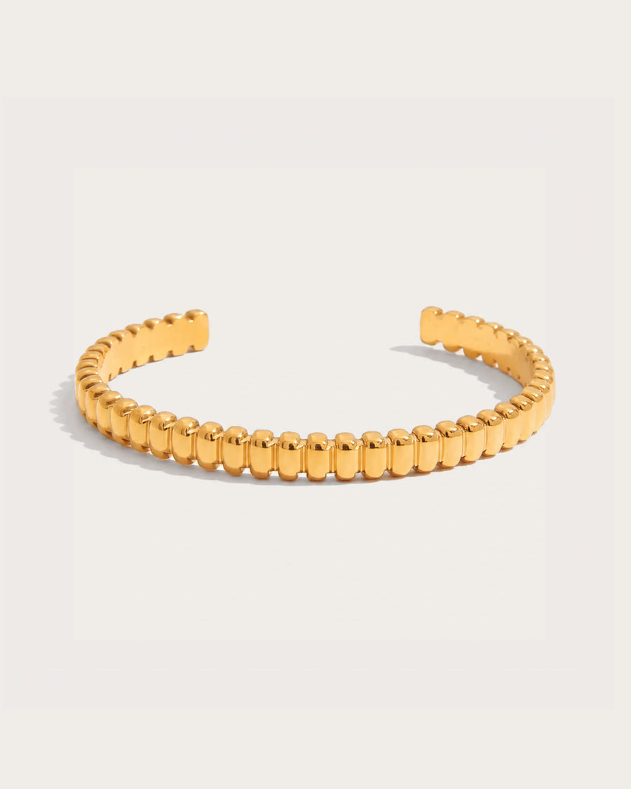 Solvi Bead Cuff Bracelet on a soft warm grey background