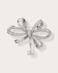 Sylvi Crystal Ribbon Brooch on a soft warm grey background