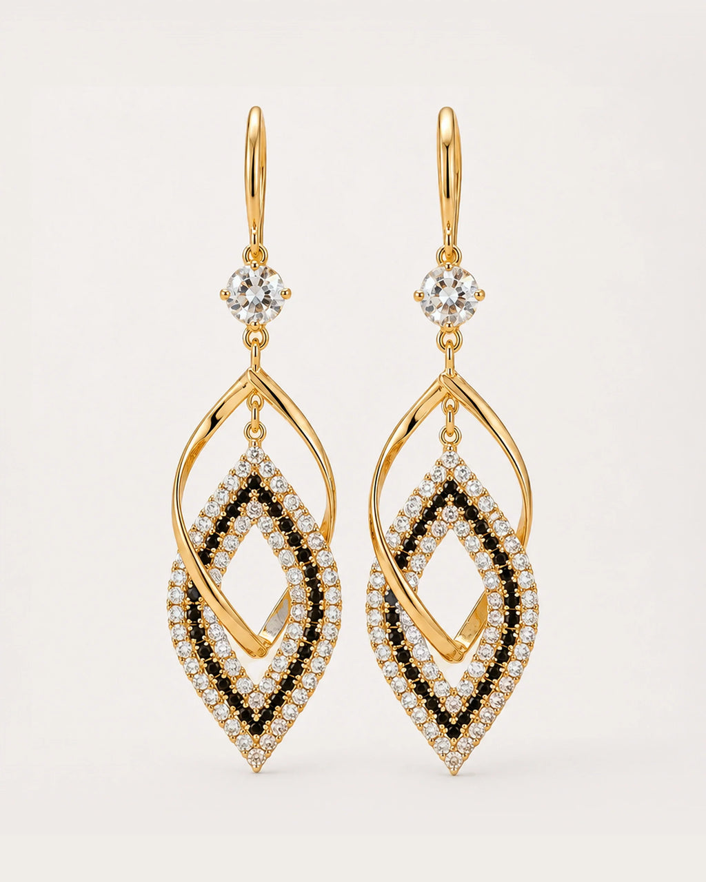 Tähti Crystal Drop Earrings on a soft warm grey background