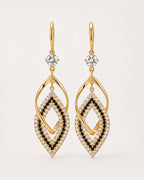Tähti Crystal Drop Earrings on a soft warm grey background