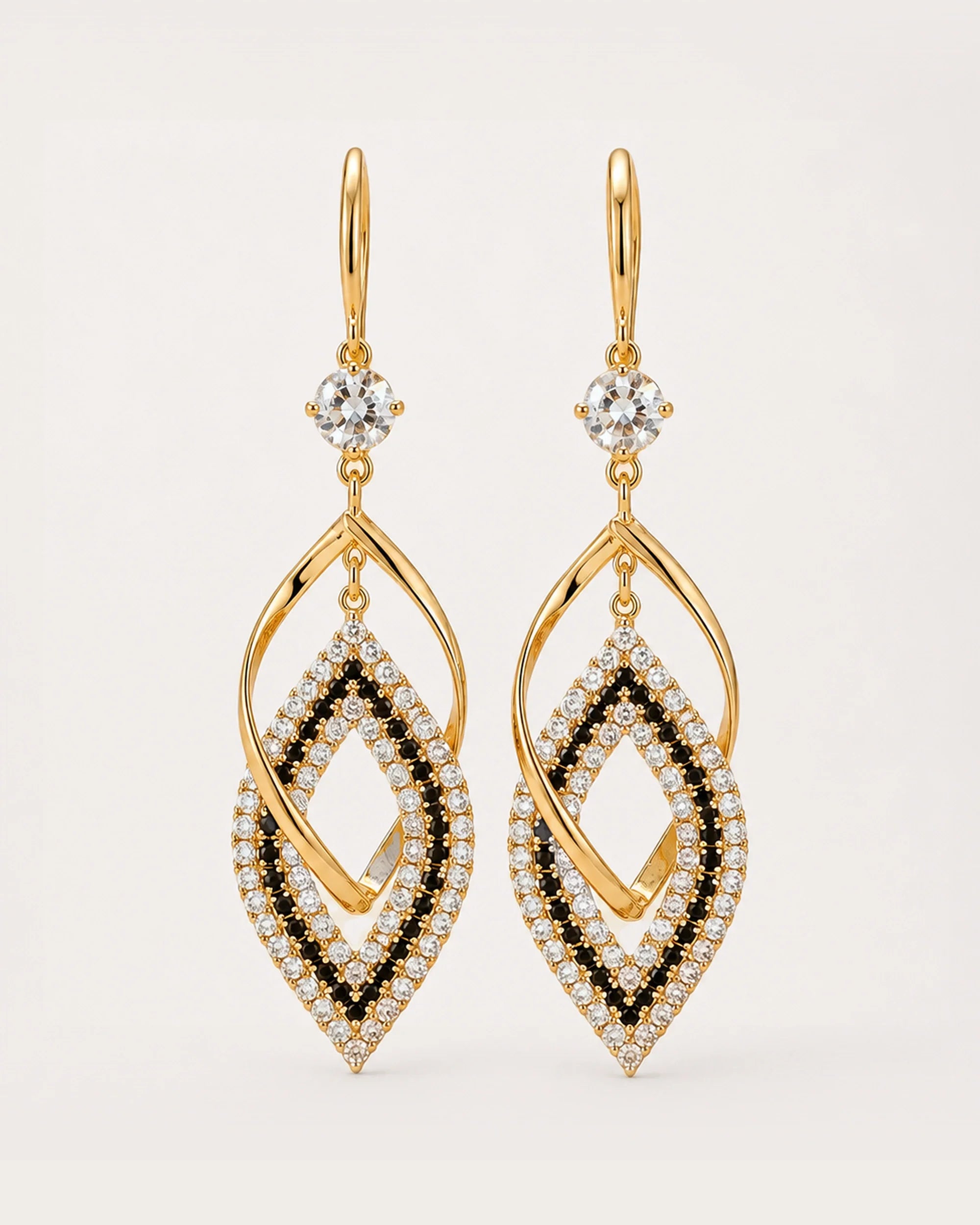 Tähti Crystal Drop Earrings on a soft warm grey background