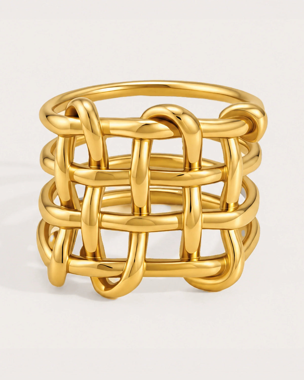 Trellis Light Wide Ring on a soft warm grey background