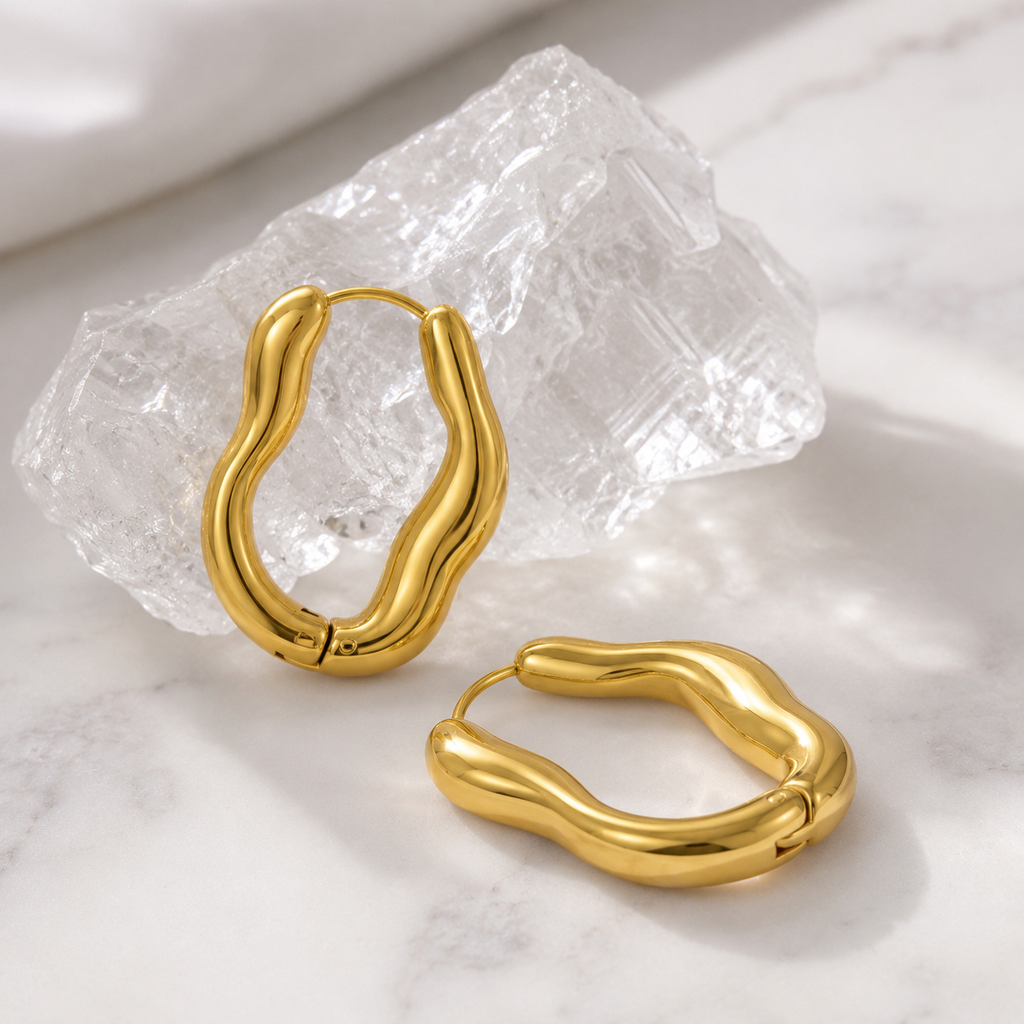 Vela Current Hoop Earrings styled product display