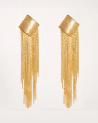 Virta Cascade Gold Earrings on a soft warm grey background