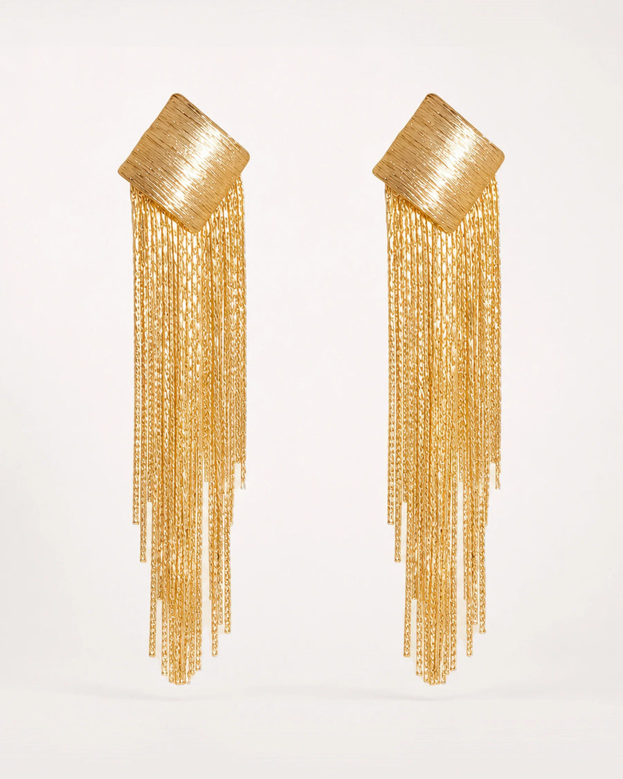 Virta Cascade Gold Earrings on a soft warm grey background