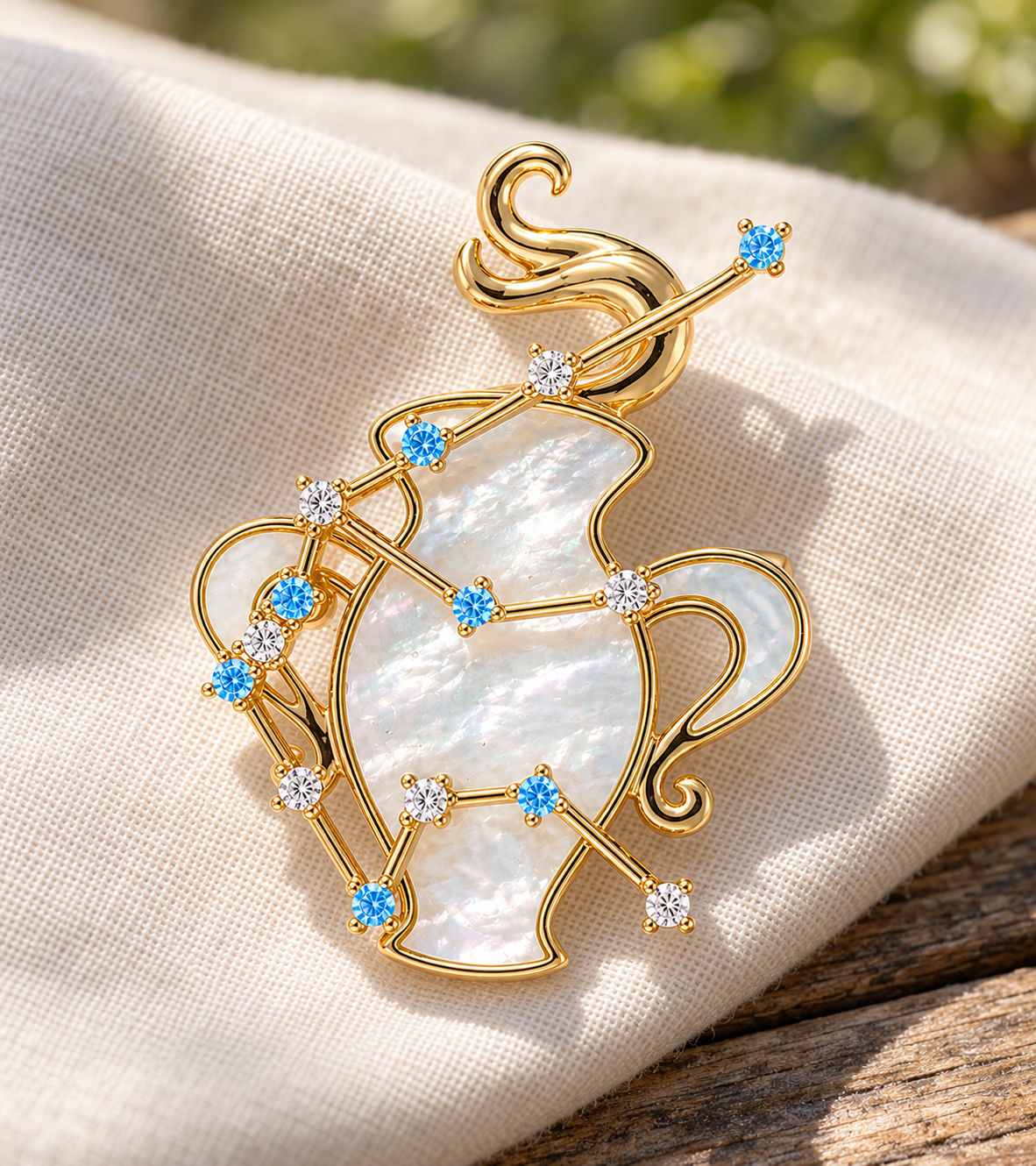 Pearl-white and blue Sagittarius zodiac brooch on ivory linen
