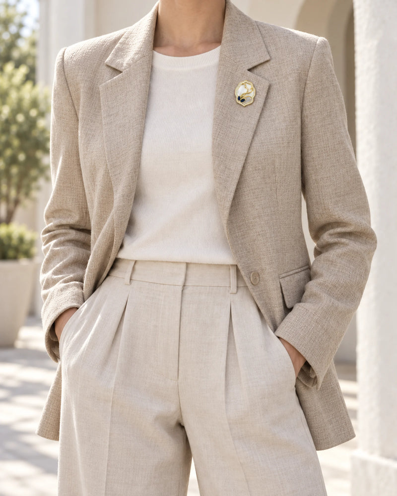 Tuuli Framed Calla Magnetic Brooch, Gold & White worn with a pale jacket, wider styling view