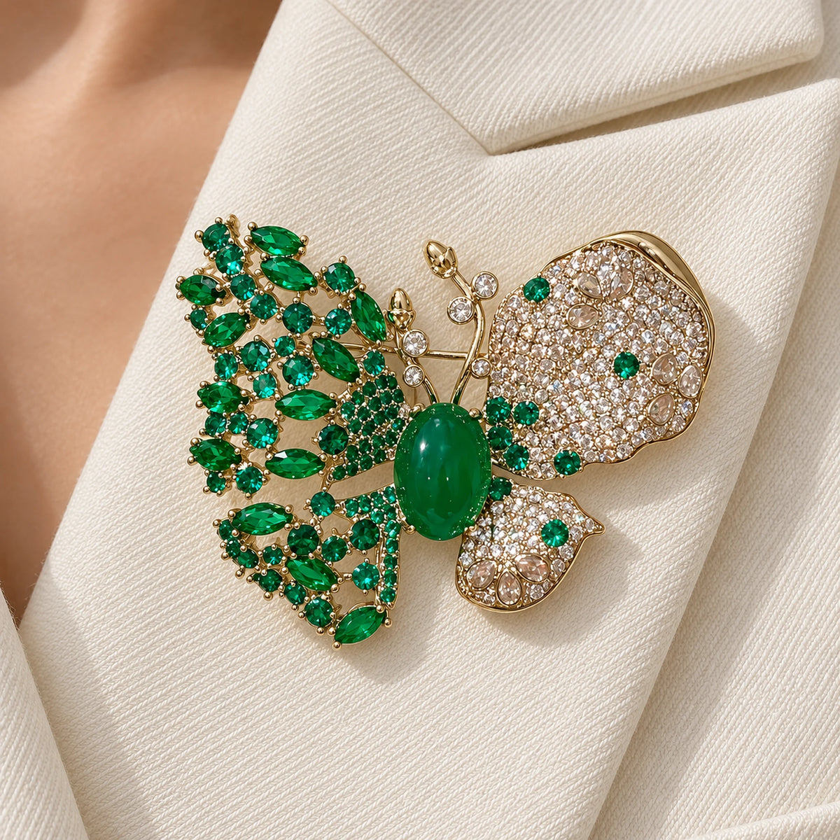 The Green butterfly rests entirely within one broad ivory twill lapel.