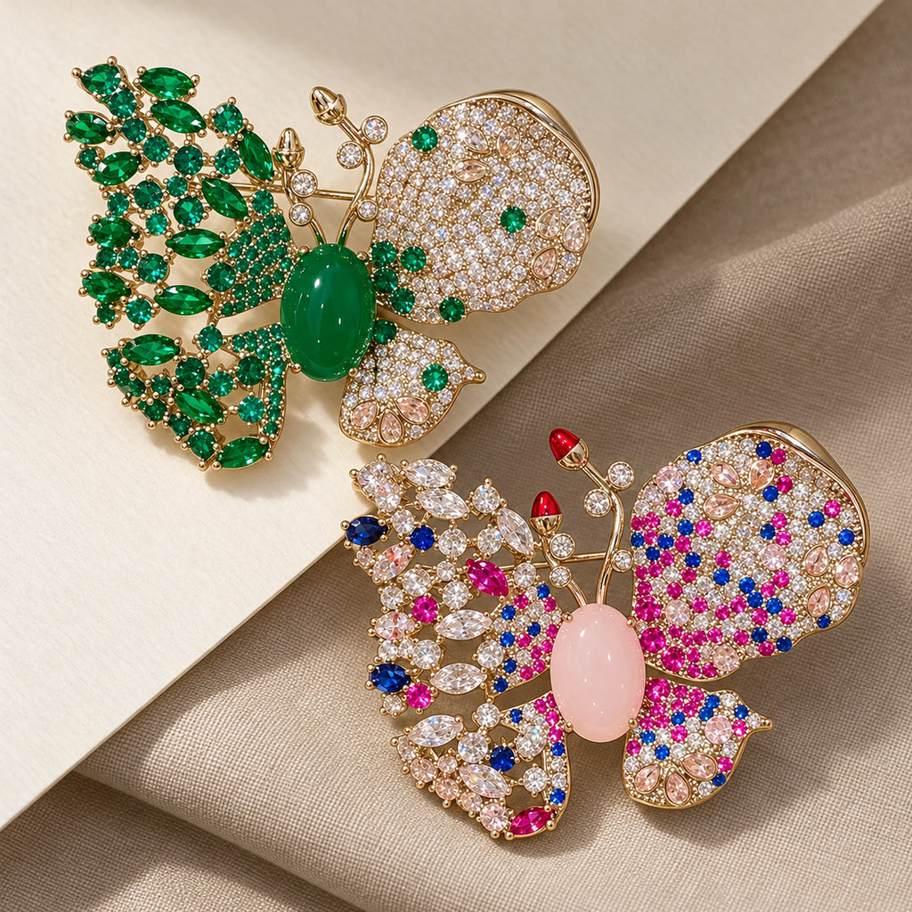 Venla butterfly brooch in Green and Pink, shown as two color choices.
