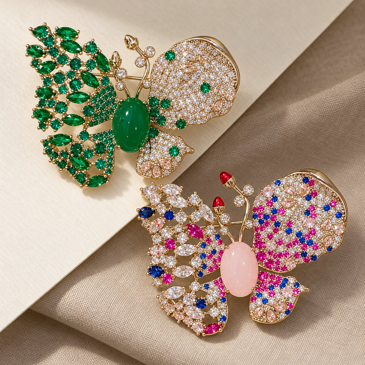 Venla butterfly brooch in Green and Pink, shown as two color choices.