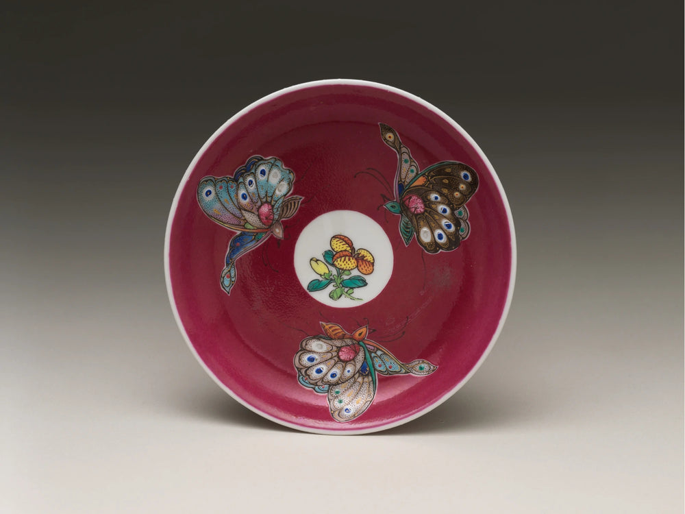 Butterflies on a painted saucer