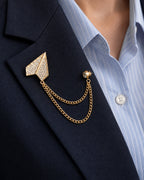 Viesti Paper Plane Lapel Chain Brooch in gold-tone finish; close wearing view on a structured lapel