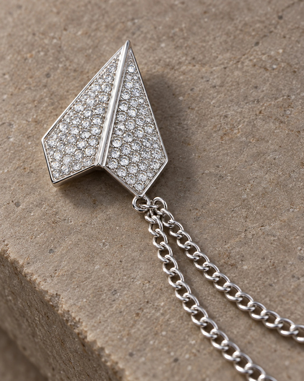 Viesti Paper Plane Lapel Chain Brooch in silver-tone finish; motif and chain detail