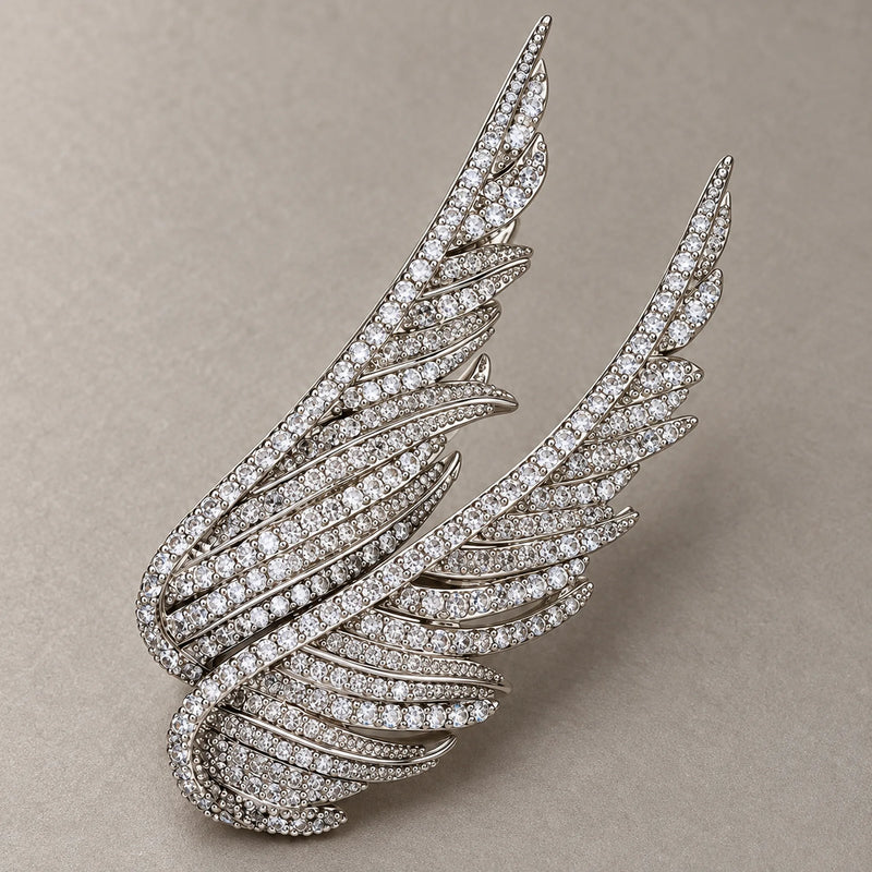 Detail of Silver Vinga showing layered feather-shaped ribs, round zircon accents and open spaces.