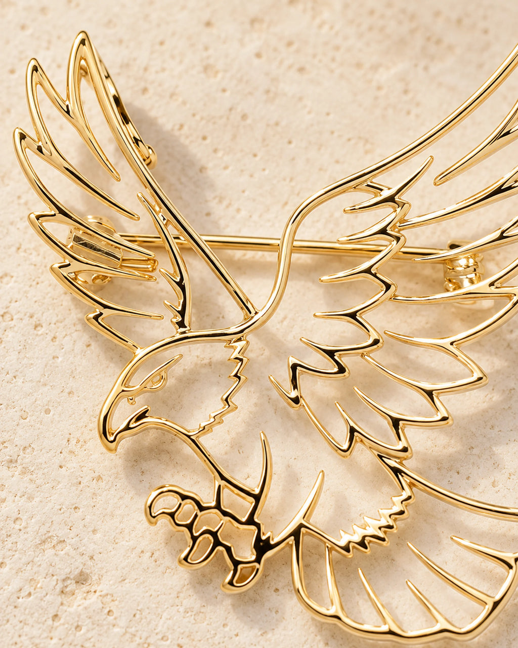 Detail of Vinge gold-plated feather outlines and open wing spaces