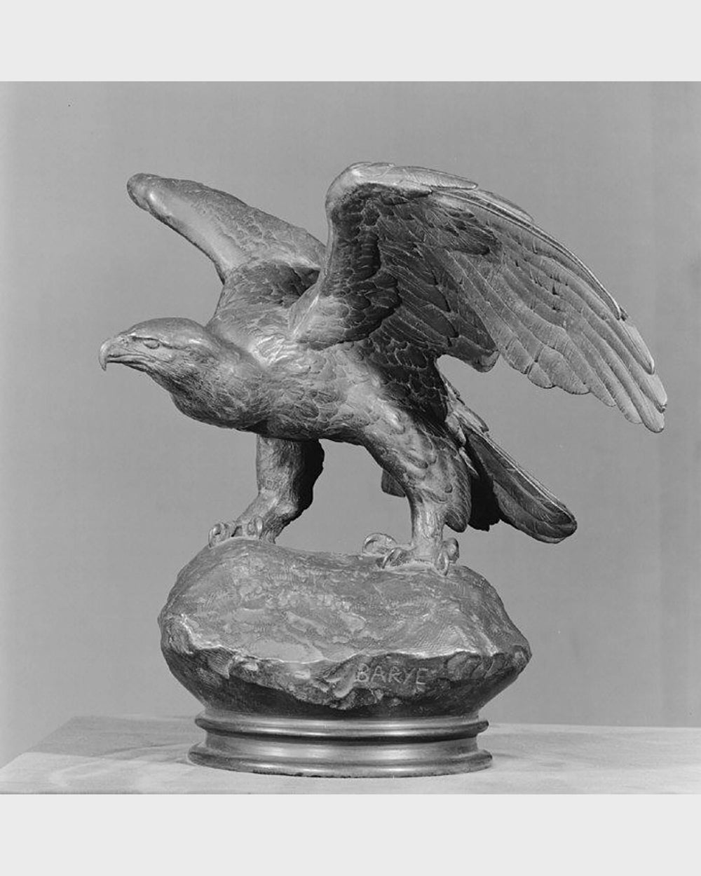 Wings held in bronze